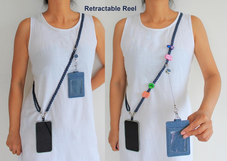 May include: A dark blue braided lanyard featuring a retractable reel, a denim-textured ID badge holder with a clear window, and a black smartphone case. The lanyard is adorned with small colorful decorative pins and charms.