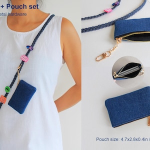 May include: A dark blue braided lanyard and denim pouch set with gold-toned metal hardware. The lanyard features colorful charms and a phone attachment. The pouch measures 4.7x2.8x0.4 inches and includes a zipper closure and a key ring.