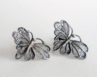 Circa 1950s European 835 silver filigree butterfly screwback earrings