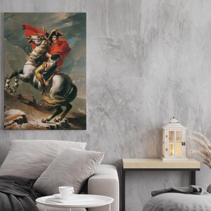 May include: A painting of a man on horseback, riding through a mountainous landscape. The man is wearing a red coat and a bicorne hat. The horse is white with a brown mane and tail.