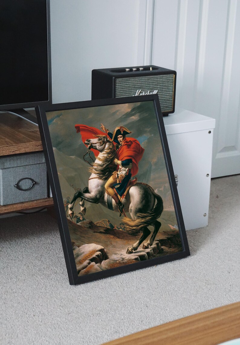 May include: A framed painting of a man on horseback, wearing a red coat and a white hat. The horse is white and is galloping up a hill. The painting is set against a backdrop of a mountainous landscape.