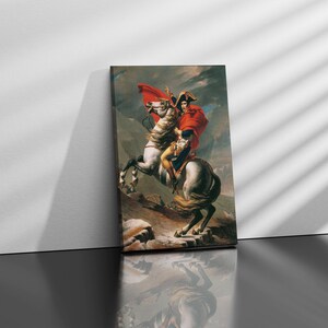 May include: A painting of a man on horseback, riding through a mountainous landscape. The man is wearing a red and white uniform and a bicorne hat. The horse is white with a brown mane and tail.