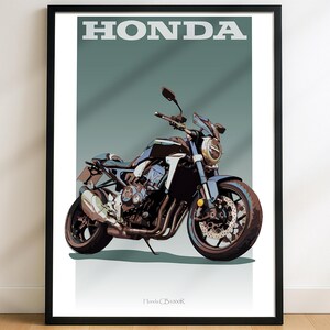May include: A framed print featuring a Honda CB1000R motorcycle illustration. The motorcycle is primarily dark blue and black, with silver exhaust pipes and wheels. The word "HONDA" is printed in white at the top. The background is a muted teal color.
