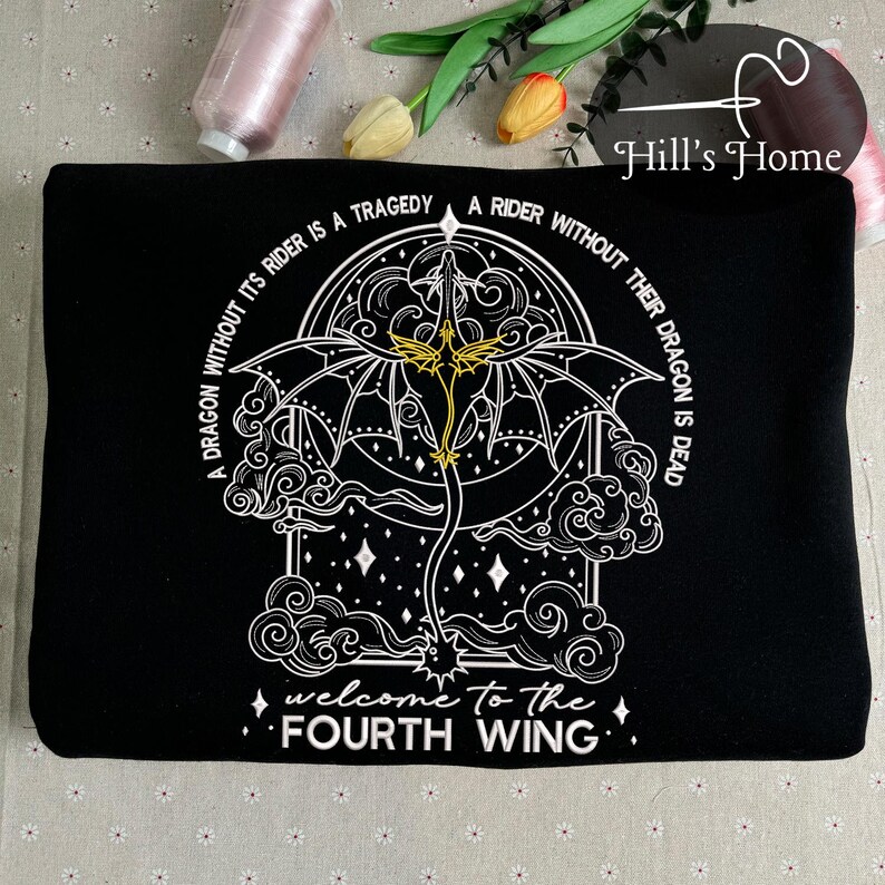 May include: Black sweatshirt with a white embroidered design of a dragon with wings spread. The design is surrounded by a circle with the text "A dragon without its rider is a tragedy. A rider without their dragon is dead. Welcome to the Fourth Wing."