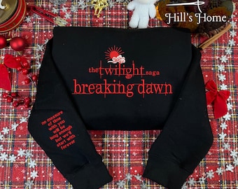 May include: Black sweatshirt with the text "the twilight saga breaking dawn" in red. The sleeve has the quote "no measure of time with you will be long enough but we'll start with forever" in red. The sweatshirt is on a red and white plaid surface.