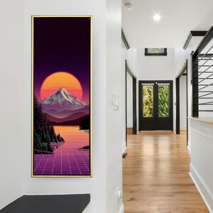 May include: A framed landscape art print featuring a mountain scene with a large orange sun setting behind the mountain. The artwork has a retro, 80s-inspired aesthetic, with a grid pattern in the foreground and a starry sky.