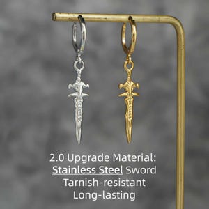 May include: Two hoop earrings featuring sword-shaped pendants, one in silver-tone and one in gold-tone metal. The text 2.0 Upgrade Material: Stainless Steel Sword Tarnish-resistant Long-lasting is printed below the earrings.