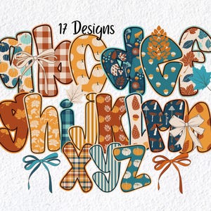 May include: A colorful alphabet design featuring letters A through Z, each with a unique autumn-themed pattern. The letters are decorated with pumpkins, leaves, and plaid patterns. The words "17 Designs" are at the top.