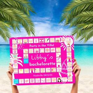 May include: A pink bachelorette party game board with the text "Party in the Villa!" and "Libby's bachelorette" with the date "09/13/25" and location "Nashville". The board has various drinking game instructions.
