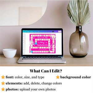 May include: A laptop displays a pink bachelorette party invitation with the text "Libby's bachelorette" and "Party in the Villa!" on the screen. The laptop is on a wooden surface, with a white bowl and a decorative vase with dried leaves nearby. The text "What Can I Edit?" is visible.