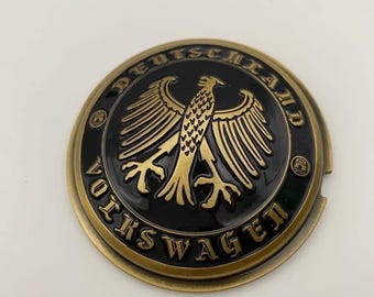 Emblema de botón de cuerno, material de aleación de zinc, color dorado y negro.