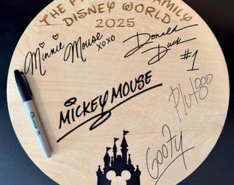 May include: A round wooden sign with the text "The Parsons Family Disney World 2025" and signatures from Mickey Mouse, Minnie Mouse, Donald Duck, Goofy, and Pluto. The sign also features a black silhouette of Cinderella's castle.