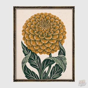 Puede incluir: Una lámina artística enmarcada que presenta una ilustración estilizada de una gran flor de dalia de color naranja dorado con pétalos complejos y superpuestos. La flor se sostiene sobre un tallo grueso y varias hojas dentadas de color verde oscuro sobre un fondo crema.