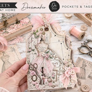 May include: A set of 9 sheets of printable paper titled Dressmaker Pockets & Tags by Oi GOI. The paper features vintage-style illustrations of dress forms, sewing patterns, floral motifs, and sewing tools in shades of cream and soft pink.