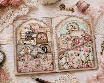May include: An open scrapbook with two pages featuring pockets filled with decorative paper tags and cards. The pages are decorated with floral patterns, vintage script, and numbers. The scrapbook is surrounded by a pocket watch, a key, and roses.