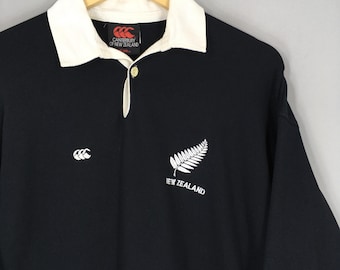 ウェア Canterbury New Zealand polo shirt black Men's Blackcaps NZ Cricket Travel Polo in Black | Canterbury