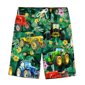 May include: Shorts featuring a vibrant tropical print with various tractors in red, yellow, green, and blue. The design includes yellow flowers and green foliage, with a white drawstring at the waist.