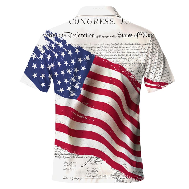 May include: A white short-sleeved shirt with a printed design of the American flag and the text "CONGRESS. July 4. 1776. Unanimous Declaration of the thirteen united States of America." The flag is faded and has a distressed look.