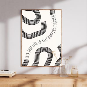 May include: Black and white abstract art print with the text "It's just life so keep dancing through".