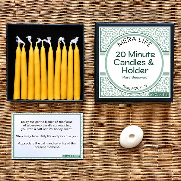 May include: A set of ten yellow beeswax candles in a black box with a lid labeled MERA LIFE 20 Minute Candles & Holder Pure Beeswax. Includes a white card with printed text and a small white oval candle holder for a single taper candle.
