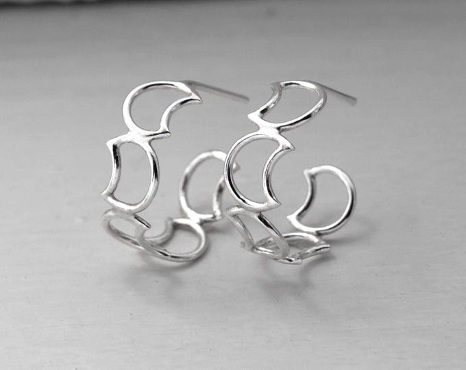 half moon hoop earring, silver earrings, women's earrings, fine jewelry, silver accessories, moon earrings.