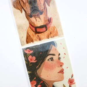 May include: Two illustrations printed on paper. The top illustration is a brown and white dog with a pink collar. The bottom illustration is a woman with brown hair and freckles, looking to the right. She is surrounded by pink flowers.