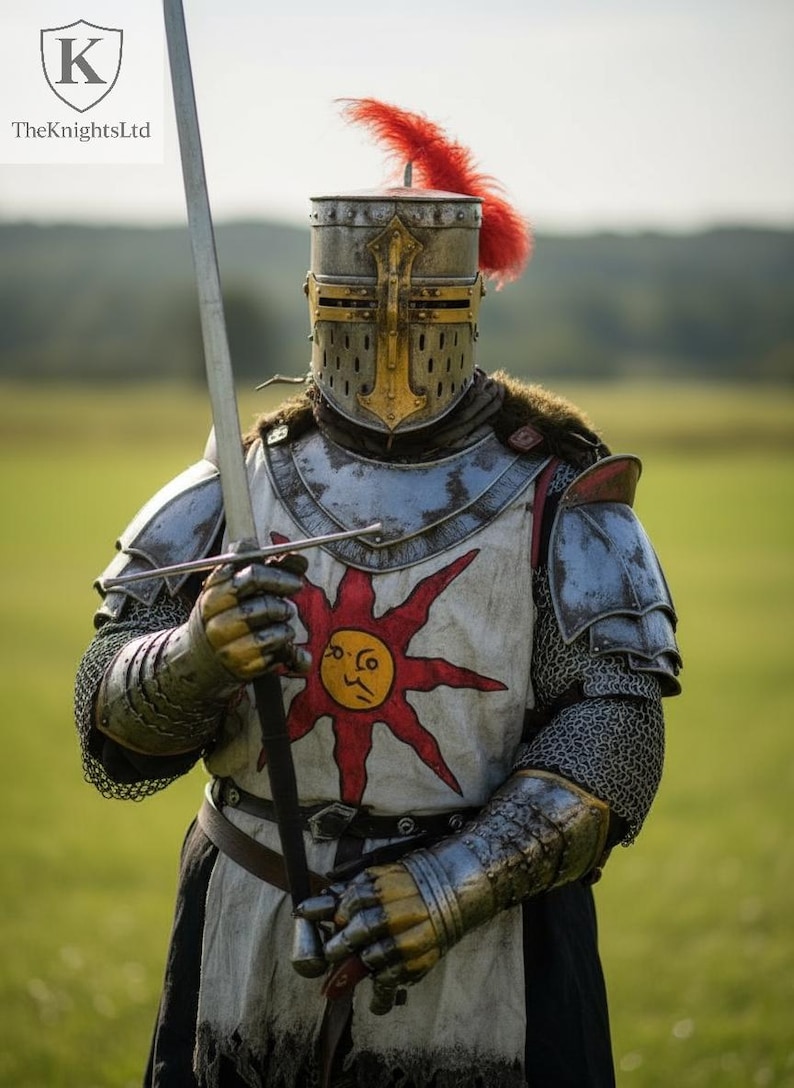 May include: A knight in full armor, holding a long sword. The helmet has a cross design and a red plume. The chest piece features a sun emblem. The KnightsLtd logo is in the top left corner. The armor is silver and gold.