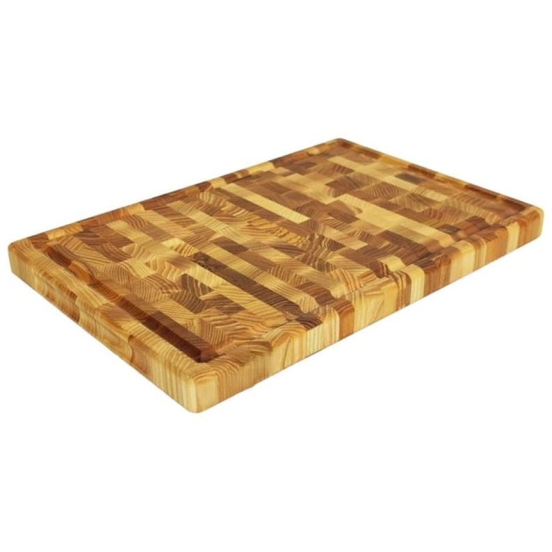 May include: A rectangular end-grain chopping board made of light and dark wood. The board features a juice groove around the edge. The wood grain pattern is visible, showing the natural variations in colour and texture. This butcher block is ideal for kitchen use.