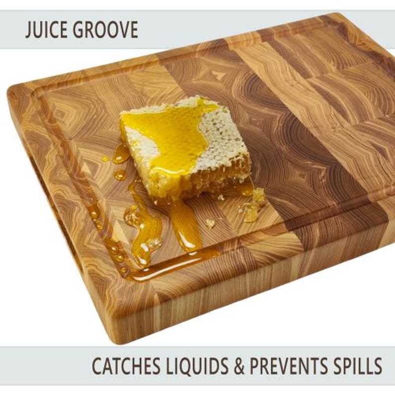May include: A wooden chopping board with a juice groove, featuring a honeycomb with dripping honey. The board is made of light and dark brown wood, with the text "JUICE GROOVE" and "CATCHES LIQUIDS & PREVENTS SPILLS".