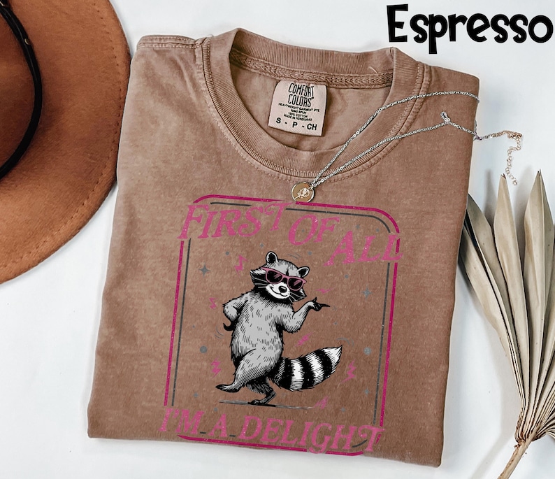 May include: A set of three ceramic mugs with a speckled, matte finish. The mugs are in shades of cream, light grey, and dark grey. Each mug has a simple, minimalist design, ideal for coffee or tea.