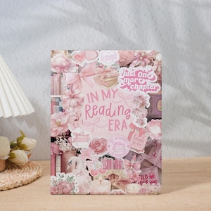 May include: A decorative book cover with a collage of pink flowers, bows, and the text "In My Reading Era." The design includes the phrase "Just one more chapter" and other book-themed elements.