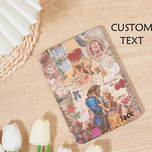 May include: A rectangular case featuring a collage design with floral and fairytale elements. The case has a romantic theme with illustrations of a couple, roses, and the text "Tale as old as Time" and "love". The name "Jack" is also visible.