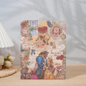 May include: A decorative rectangular item featuring a collage design with floral and romantic elements. The image includes illustrations of a couple, roses, and the text "Her", "Love", and "Tale as old as Time".