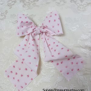 May include: A set of three ceramic mugs with a speckled, matte finish. The mugs are in shades of cream, light gray, and dark gray. Each mug has a simple, minimalist design and a rounded handle. Perfect for coffee or tea.