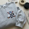 Team Hollanov Embroidered Sweatshirt, LGBT Hockey Romance Shirt, Heated Rivalry Inspired Crewneck, Hollander Rozanov Fan Gift product logo