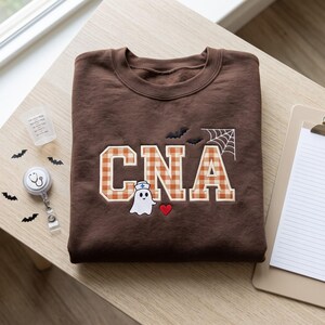 Embroidered CNA Sweatshirt, Nursing Assistant Ghost Hoodie, Cute Halloween CNA Pullover, Spooky Caregiver Hospital Crewneck