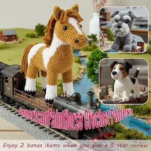 May include: A crochet horse with brown and white markings stands on a model train. The image also features crochet dog figures. The text "American Paint Horse Crochet Pattern" is displayed. The background includes a miniature landscape with a river and buildings.