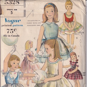 May include: A vintage sewing pattern for five different children's dresses. The pattern is illustrated with a girl wearing a blue dress with a white collar and a white sash. The pattern is called "Vogue printed pattern" and costs 75 cents. The pattern is 85 cents in Canada.