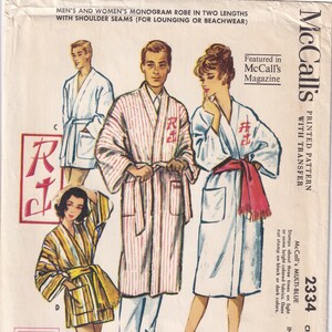 May include: A sewing pattern for a robe with a monogram transfer. The pattern is for men and women and comes in two lengths. The pattern is from McCall's and the pattern number is 2334. The pattern is printed on a white background with a pink and blue color scheme.
