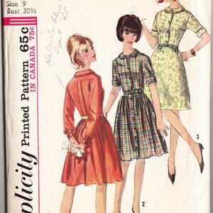 May include: Simplicity sewing pattern number 6042 for a junior size 9 dress with a 30 1/2 inch bust. The pattern shows three different styles of dresses: a red dress with long sleeves, a plaid dress with short sleeves, and a floral dress with short sleeves.