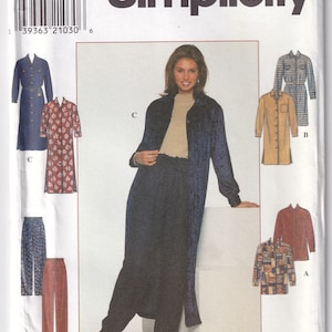 May include: A sewing pattern for a long, blue, button-down shirt dress with a long sleeve. The pattern also includes a long, brown, button-down shirt dress with a long sleeve, a short-sleeved, plaid shirt, a long-sleeved, red shirt, and a pair of pants. The pattern is Simplicity 7902, size H 6, 8, 10, EUR 32-36, FR 34-38.