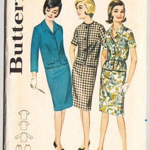 May include: A vintage sewing pattern for a dress with three different styles. The pattern is for a size 14 bust and includes instructions for a blue dress with a jacket, a black and white gingham dress, and a floral print dress.