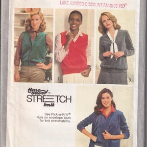 May include: A Simplicity 9075 sewing pattern envelope for miss sizes H (6, 8, 10). The front displays four garment variations: a green vest, a red vest, a grey jacket with a white tie, and a blue jacket with a red collar, all featuring stretch knit fabric.