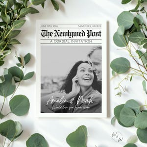 May include: A black and white wedding invitation designed to look like a newspaper front page. The headline reads "The Newlywed Post" with the date June 12th, 2026, and the location Santorini, Greece. The invitation features a photo of a smiling couple and their names.
