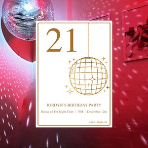 May include: A white card with gold text and a gold disco ball graphic. The text reads "21", "JORDYN'S BIRTHDAY PARTY", "House of Yes Night Club | 7PM | December 12th", and "Attire | Studio 54".