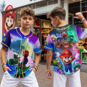 May include: A set of three ceramic mugs with a speckled, cream-colored glaze. Each mug features a different hand-painted floral design in shades of blue, green, and yellow. The mugs have a simple, rounded shape.