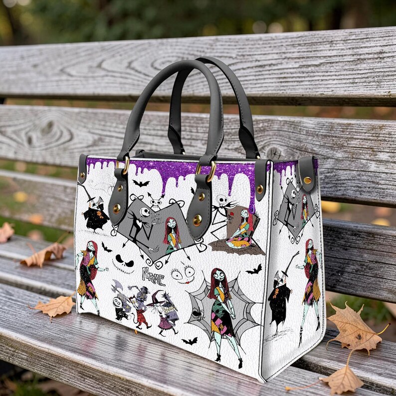 May include: A white ceramic mug with a black handle and the text "But First, Coffee" in a bold, black font. The mug is set against a blurred background, suggesting a cozy setting.