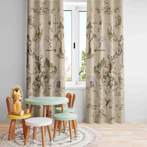 May include: A set of Winnie the Pooh themed curtains featuring a map of the Hundred Acre Wood. The curtains are beige with brown and green illustrations. The curtains are hung in a room with a small table and chairs.