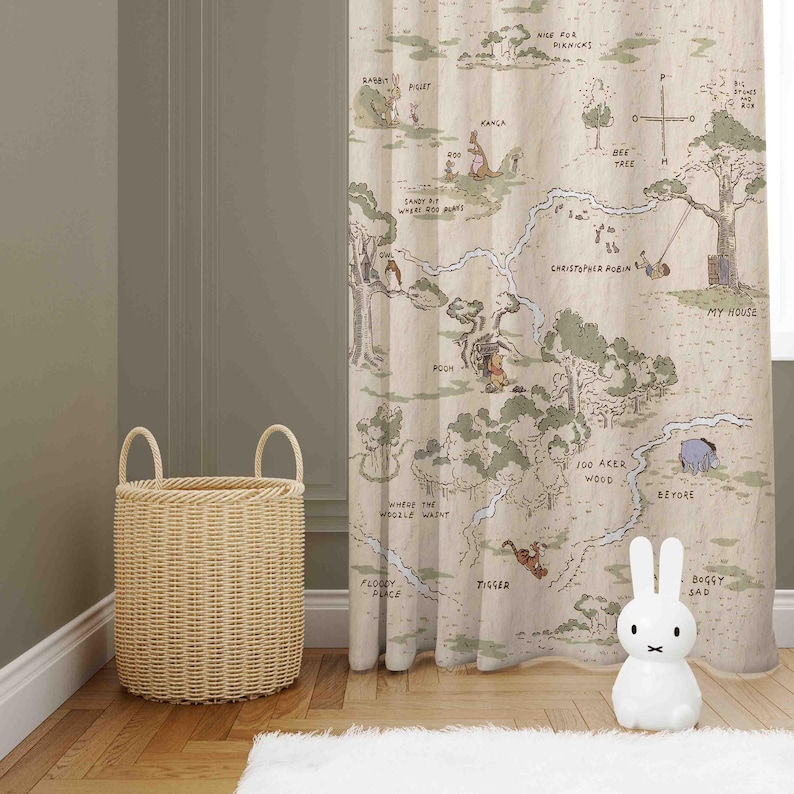 May include: A Winnie the Pooh themed shower curtain featuring a map of the Hundred Acre Wood with various characters and locations, including Rabbit, Piglet, Kanga, Roo, Eeyore, Tigger, and Christopher Robin. The curtain is beige with brown and green illustrations.