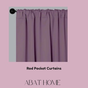 May include: A pair of mauve rod pocket curtains. The curtains are made of a soft, smooth fabric and have a simple, elegant design. Rod Pocket Curtains. ABAT HOME.
